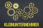 © magele-picture - stock.adobe.com Zahnräder und Schriftzug Kleinunternehmer